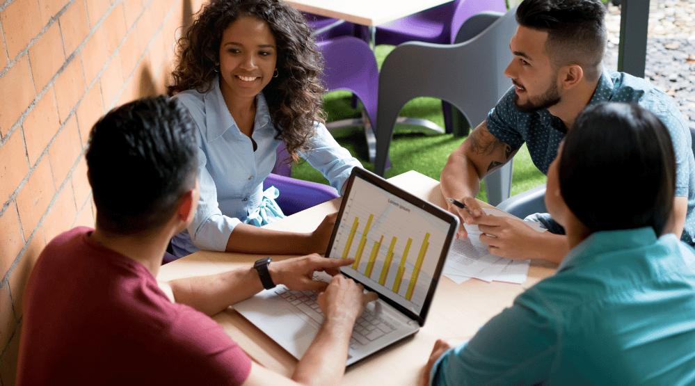 stock - team around laptop